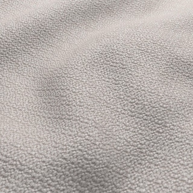 Soft greige pebbled loop texture with subtly mottled light and shadow