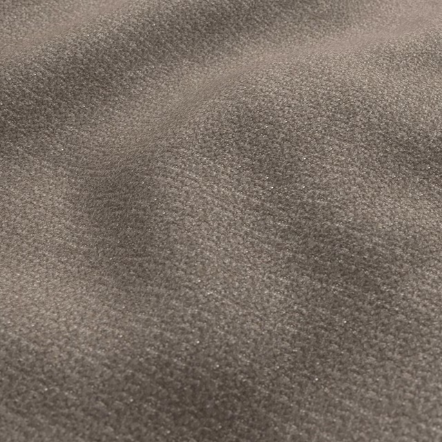 Close-up of softly mottled greige fabric with a fine, tactile surface