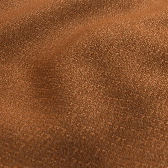 Warm russet-brown fabric with dense nubby texture and subtle tonal variation