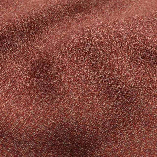 Warm strawberry-red textile with dense flecked weave and subtle lighter threads