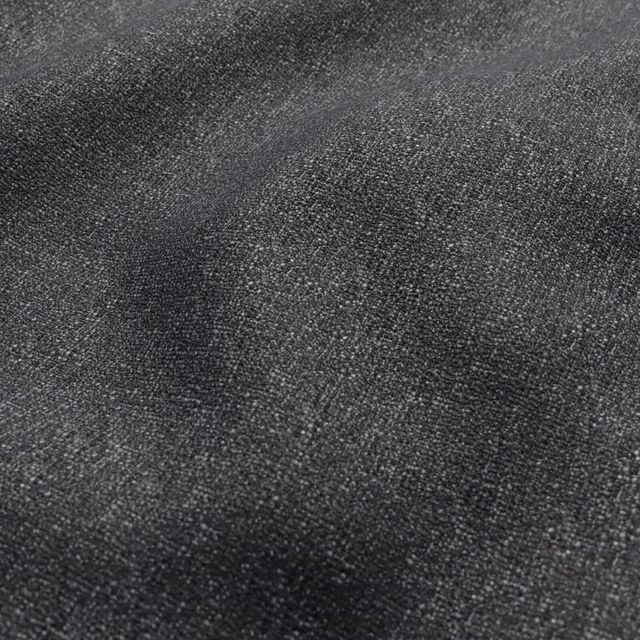 Deep soot charcoal woven fabric with fine nubby texture and subtle tonal variation