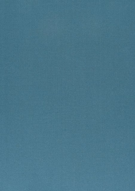Close-up of muted blue-steel fabric with a fine softly mottled weave