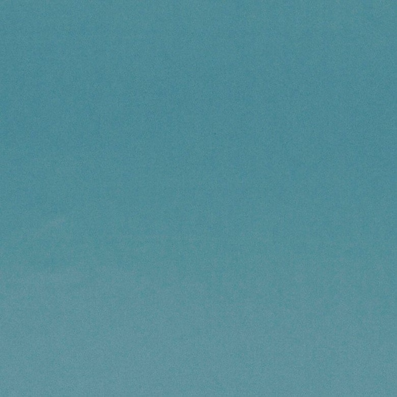 Muted blue-teal plain fabric swatch with a fine softly mottled texture