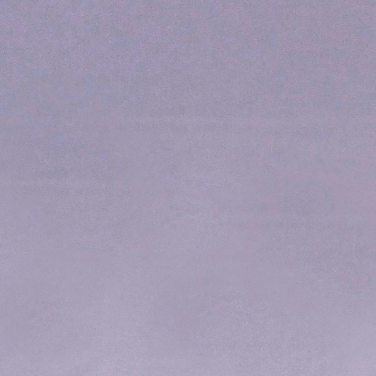 Dusty lavender-mauve fabric with subtle mottled texture and an even plain surface