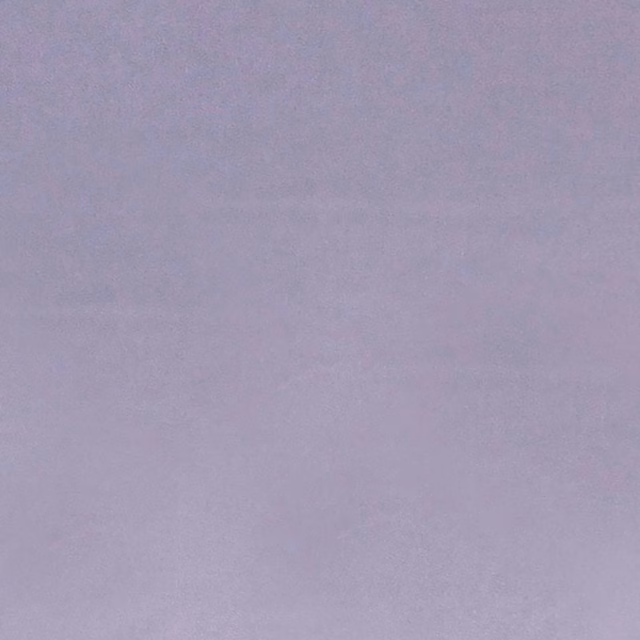 Dusty lavender-mauve fabric with subtle mottled texture and an even plain surface