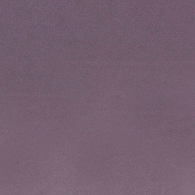 Close-up of muted damson-purple fabric with a smooth, softly mottled surface