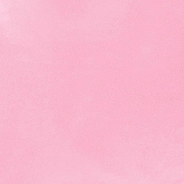 Close-up of smooth hot-pink textile with a fine, softly mottled surface
