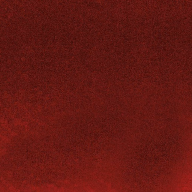 Deep spice-red fabric with subtle mottled shading and a soft, low-lit surface