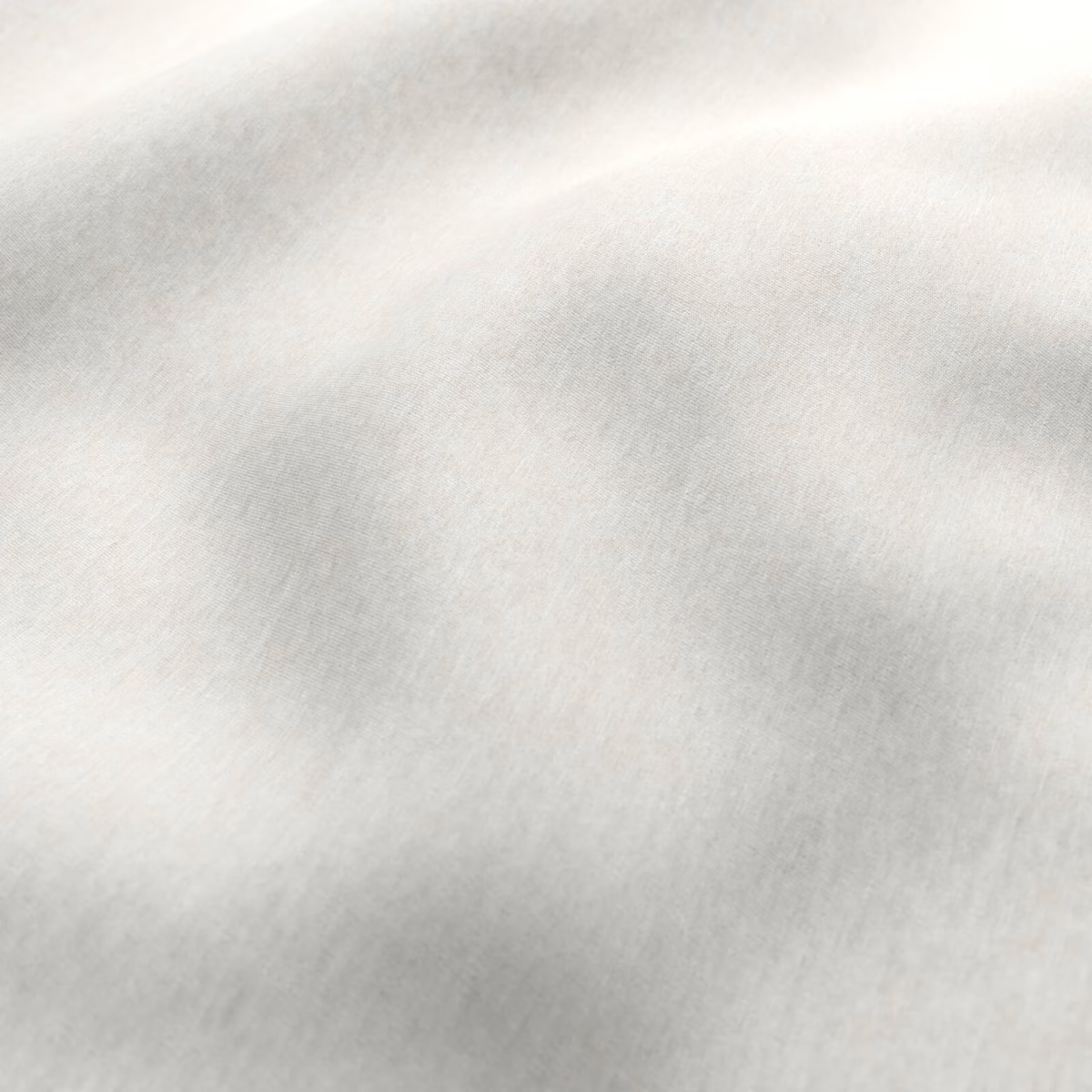 Pale parchment cream fabric with softly mottled grey-beige brushed texture