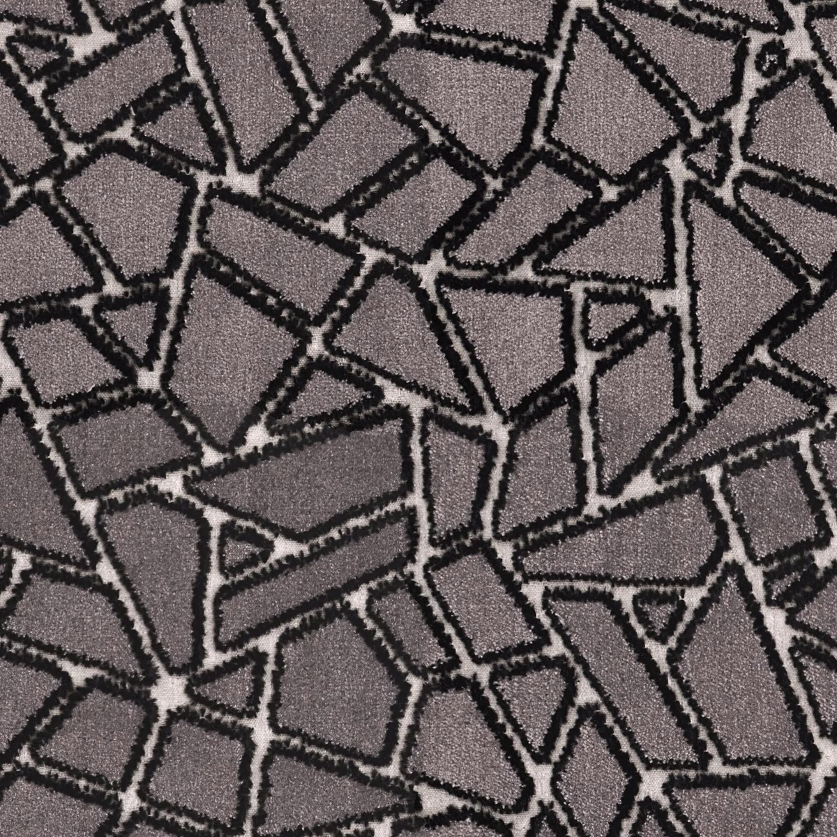 Close-up of charcoal grey fabric with black irregular geometric mosaic outlines and fine texture