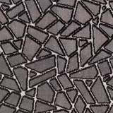 Close-up of charcoal grey fabric with black irregular geometric mosaic outlines and fine texture