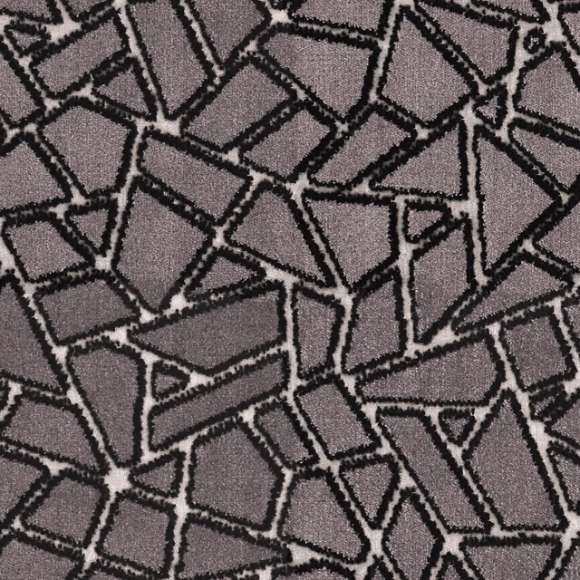 Close-up of charcoal grey fabric with black irregular geometric mosaic outlines and fine texture