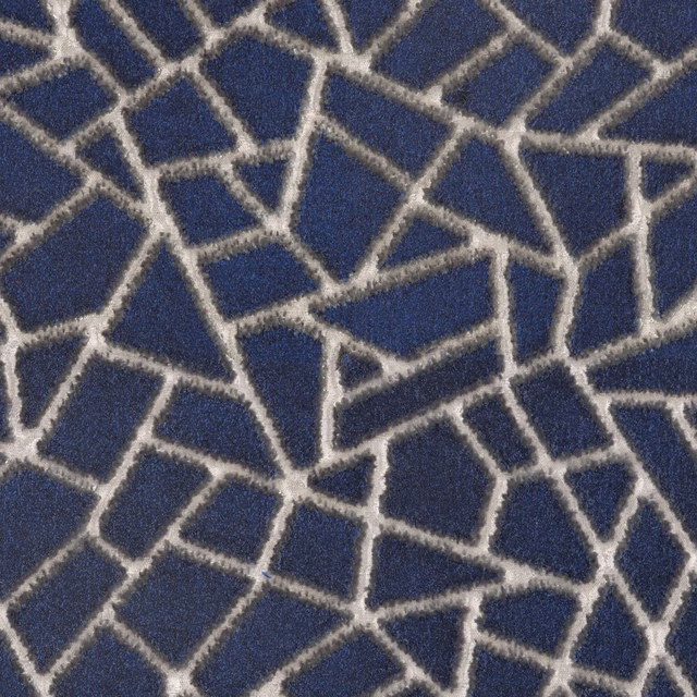 Ink-blue textured fabric with irregular cream lines forming fractured geometric cells