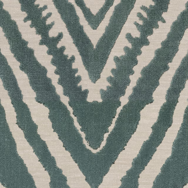 Muted blue-green geometric Deco weave on a warm cream fabric ground