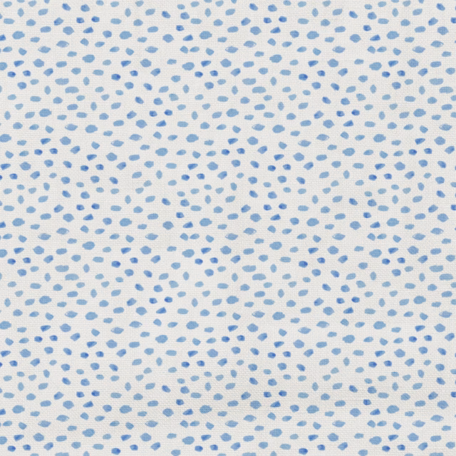Pale blue textile with scattered darker blue pebble-like dots across a fine surface