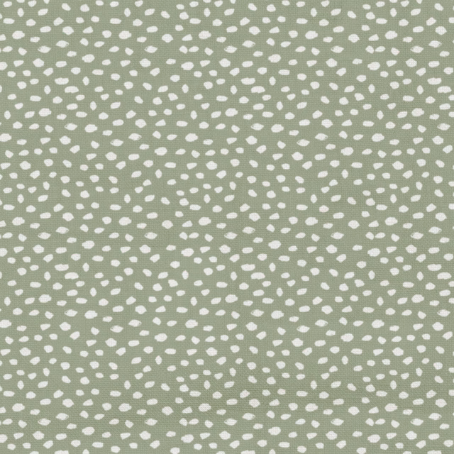 Soft sage-green textile with scattered white pebble-like dots and subtle woven texture