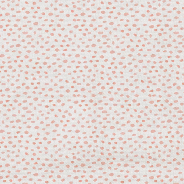 Pale cream textile with scattered small blush-pink flecks and a fine woven texture