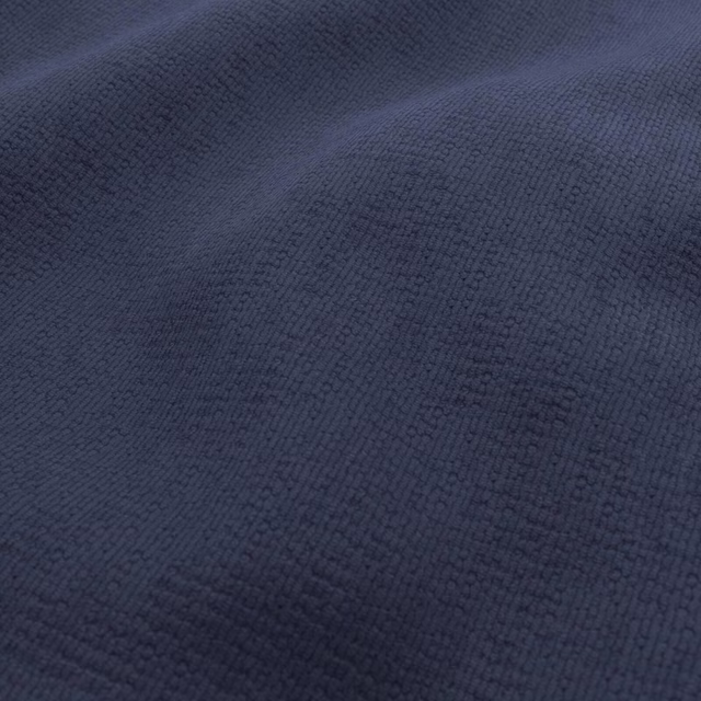 Deep navy Dream fabric with a fine, raised woven texture in close view