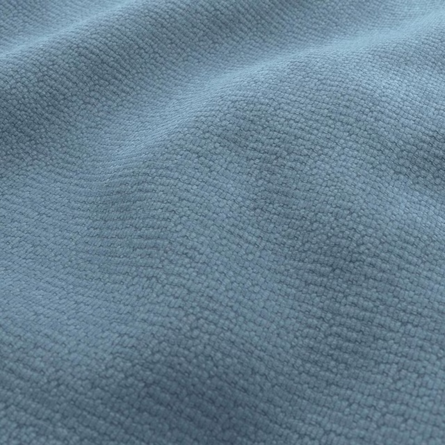 Close view of muted blue-grey Dream fabric with dense nubby woven texture