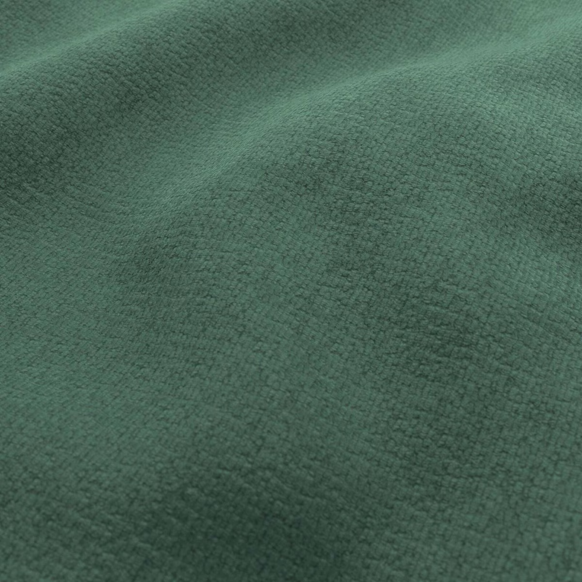 Close view of emerald-green fabric with a fine, softly pebbled woven texture