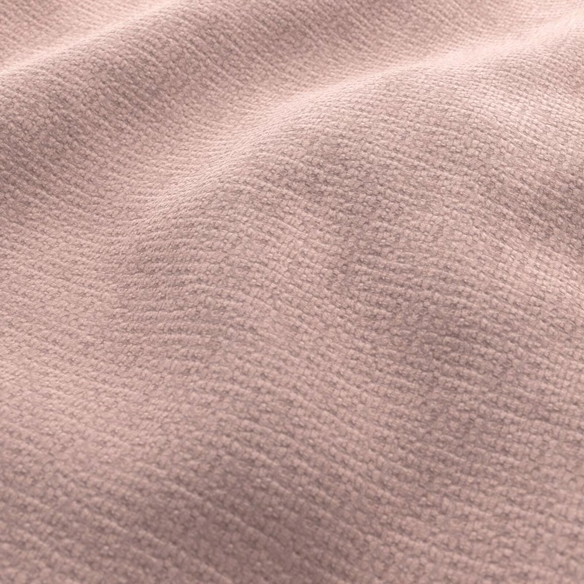 Dusty blush pink fabric with softly rippled, nubby woven texture