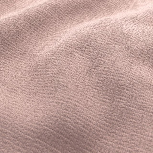 Dusty blush pink fabric with softly rippled, nubby woven texture