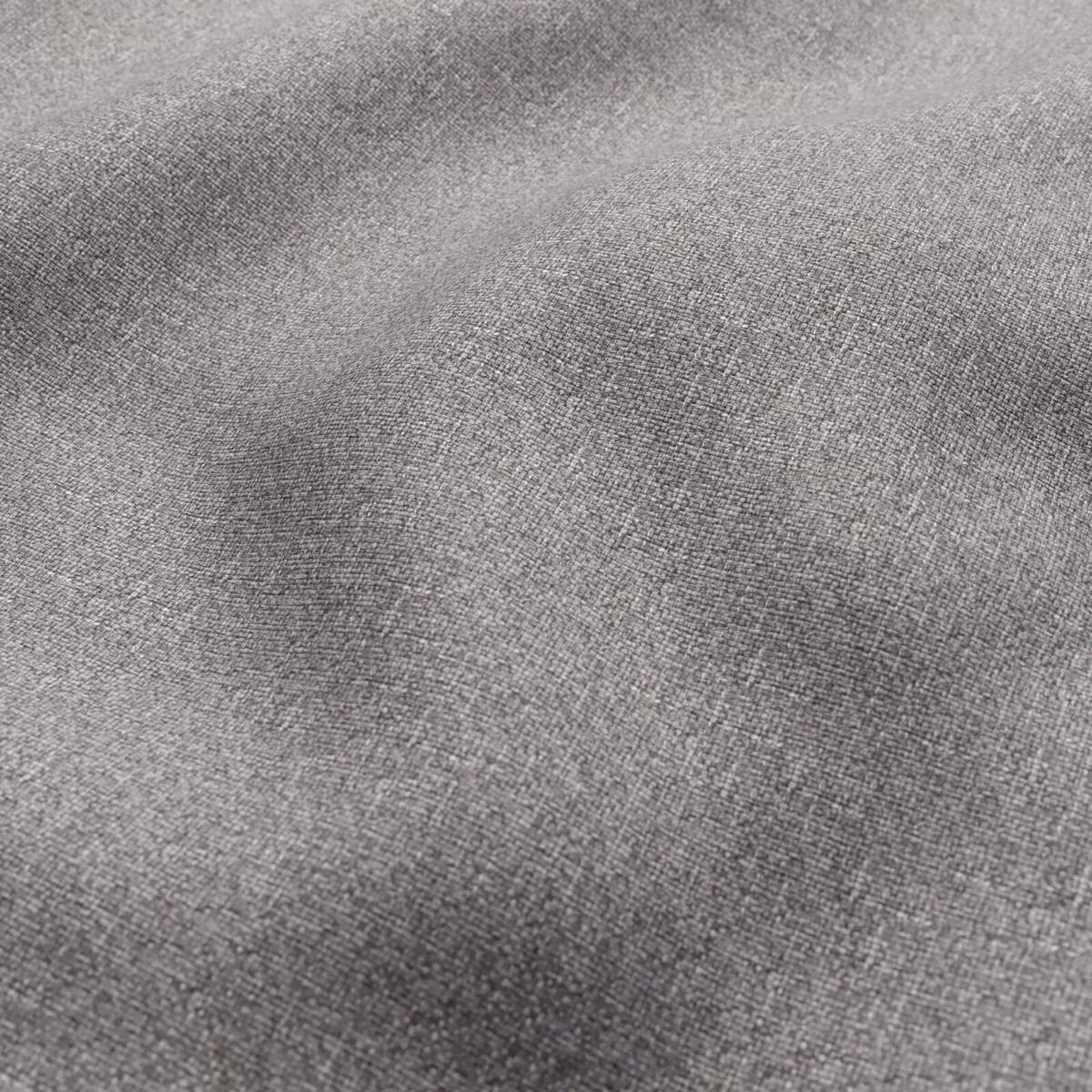 Close-up of mottled gravel-grey woven fabric with fine charcoal and silver tonal variation