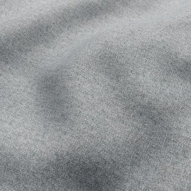 Close view of mottled grey-green lichen fabric with a fine woven texture