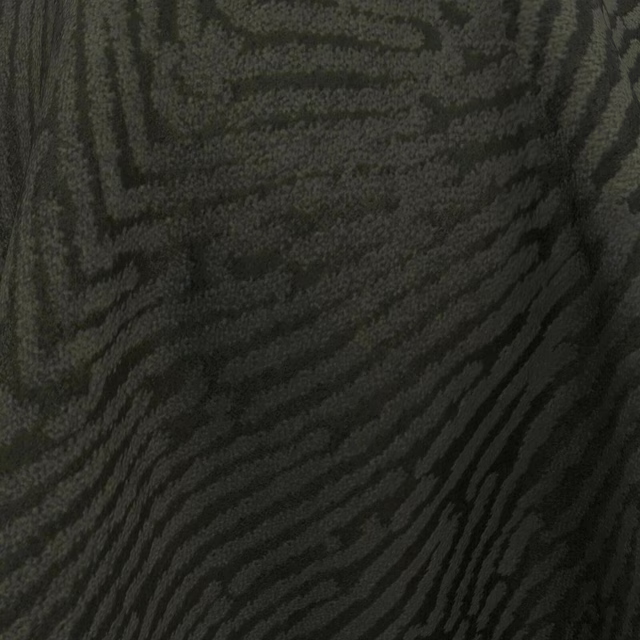 Almost-black charcoal textile showing raised, flowing tonal stripes and a softly brushed surface