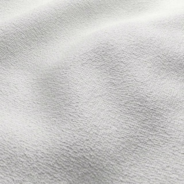 Close-up of pale chalk-grey fabric with a softly rippled plush napped texture