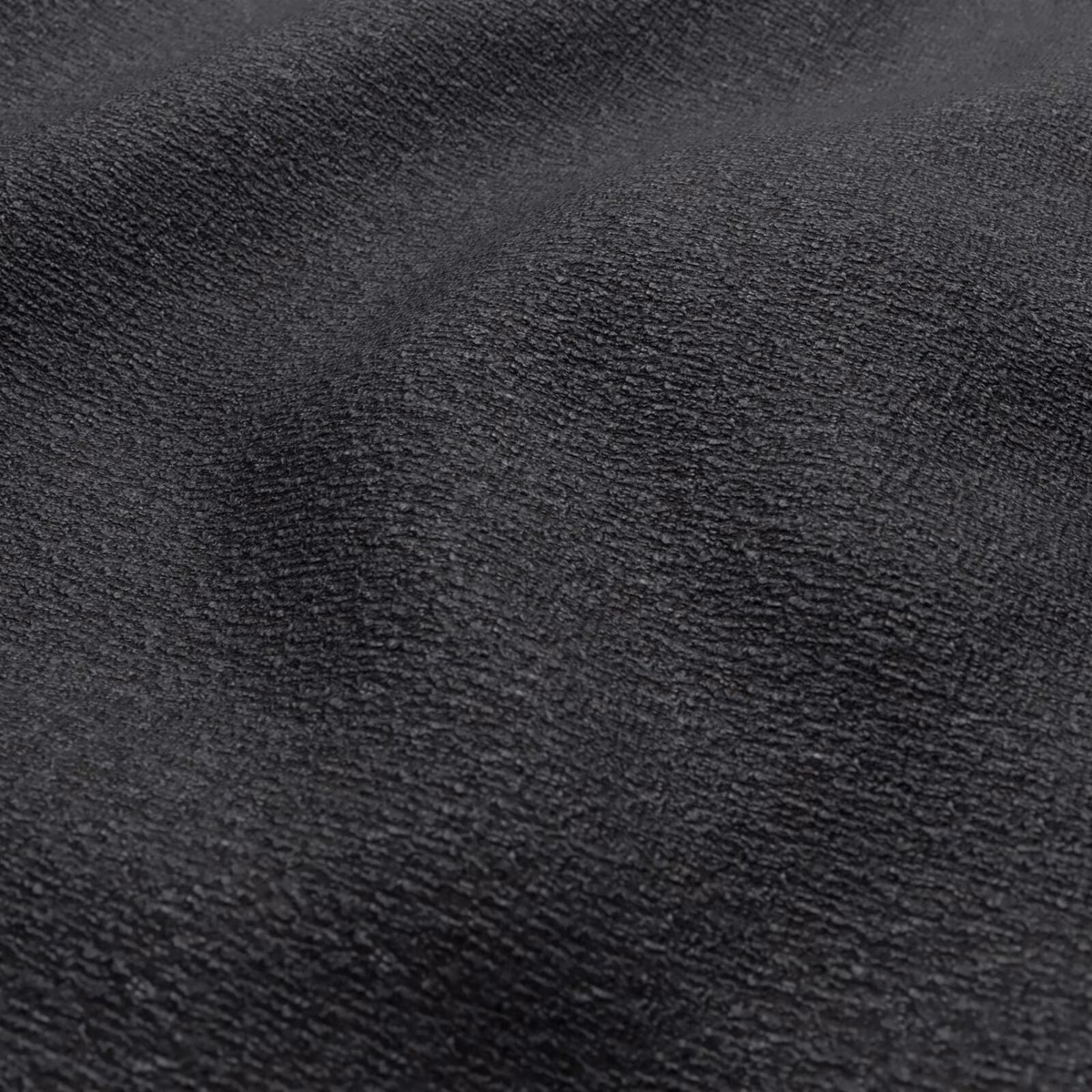 Near-black peat fabric with dense, softly rippled charcoal texture