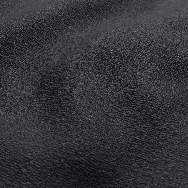 Near-black peat fabric with dense, softly rippled charcoal texture