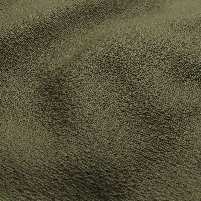 Close-up of muted hunter olive fabric with dense nubby texture and directional shading