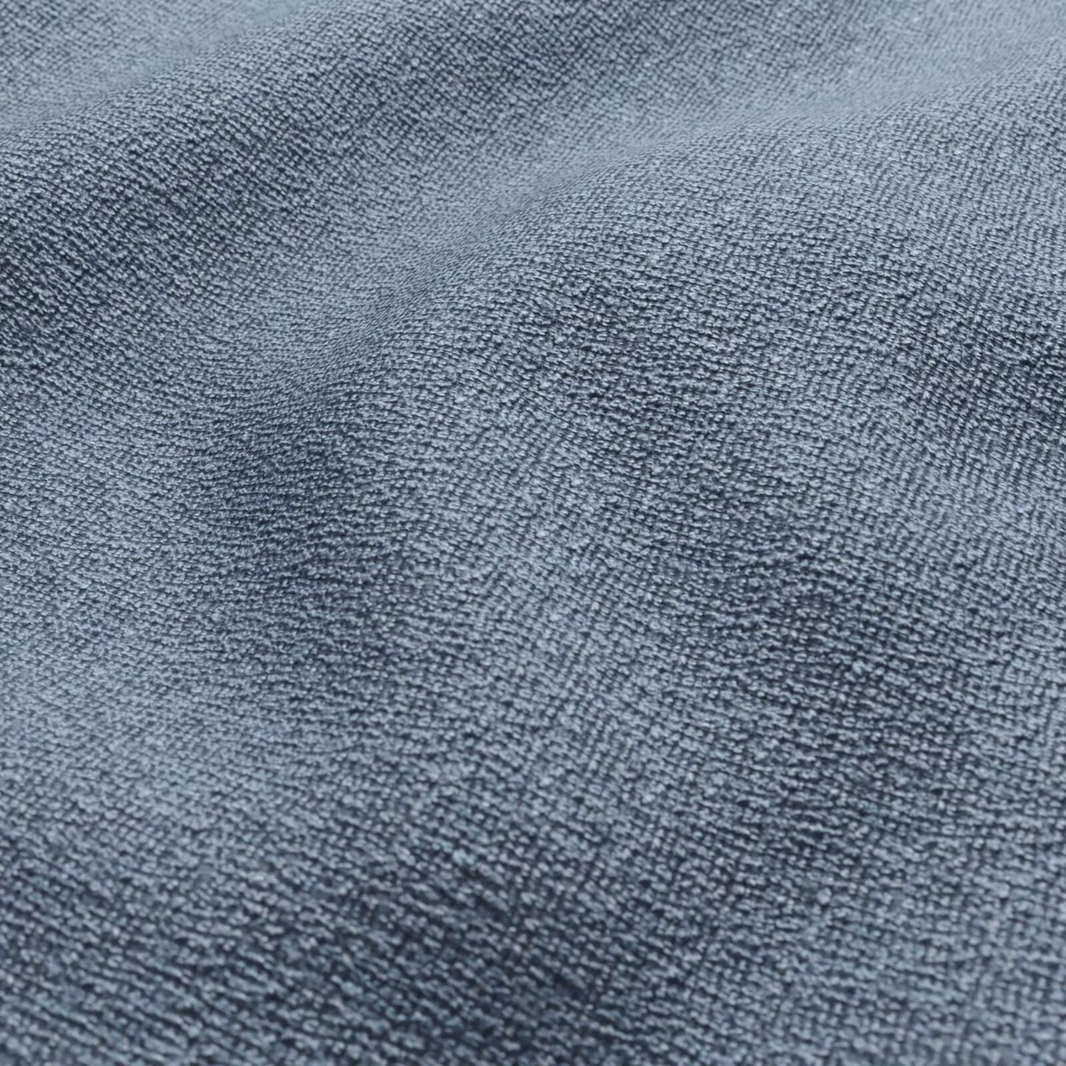 Close-up of muted powder-blue fabric with dense, softly nubby woven texture