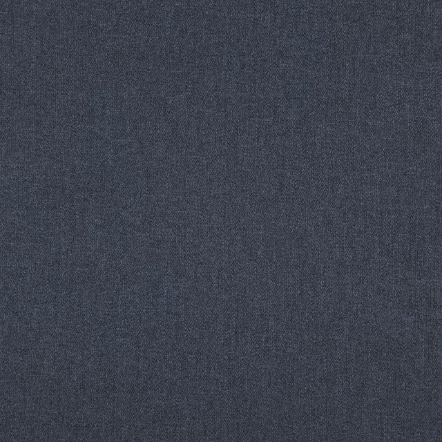Close-up of deep indigo fabric with a fine, subtly mottled woven surface