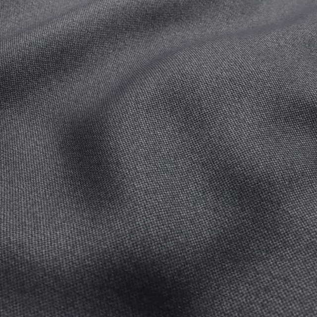 Close-up of cool graphite-grey fabric showing a fine, tightly woven crossweave