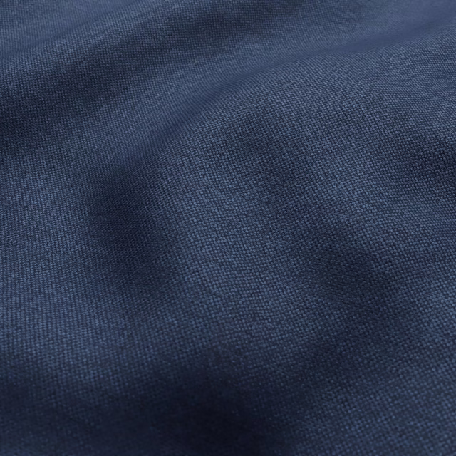 Deep navy woven fabric with fine texture and softly shaded folds