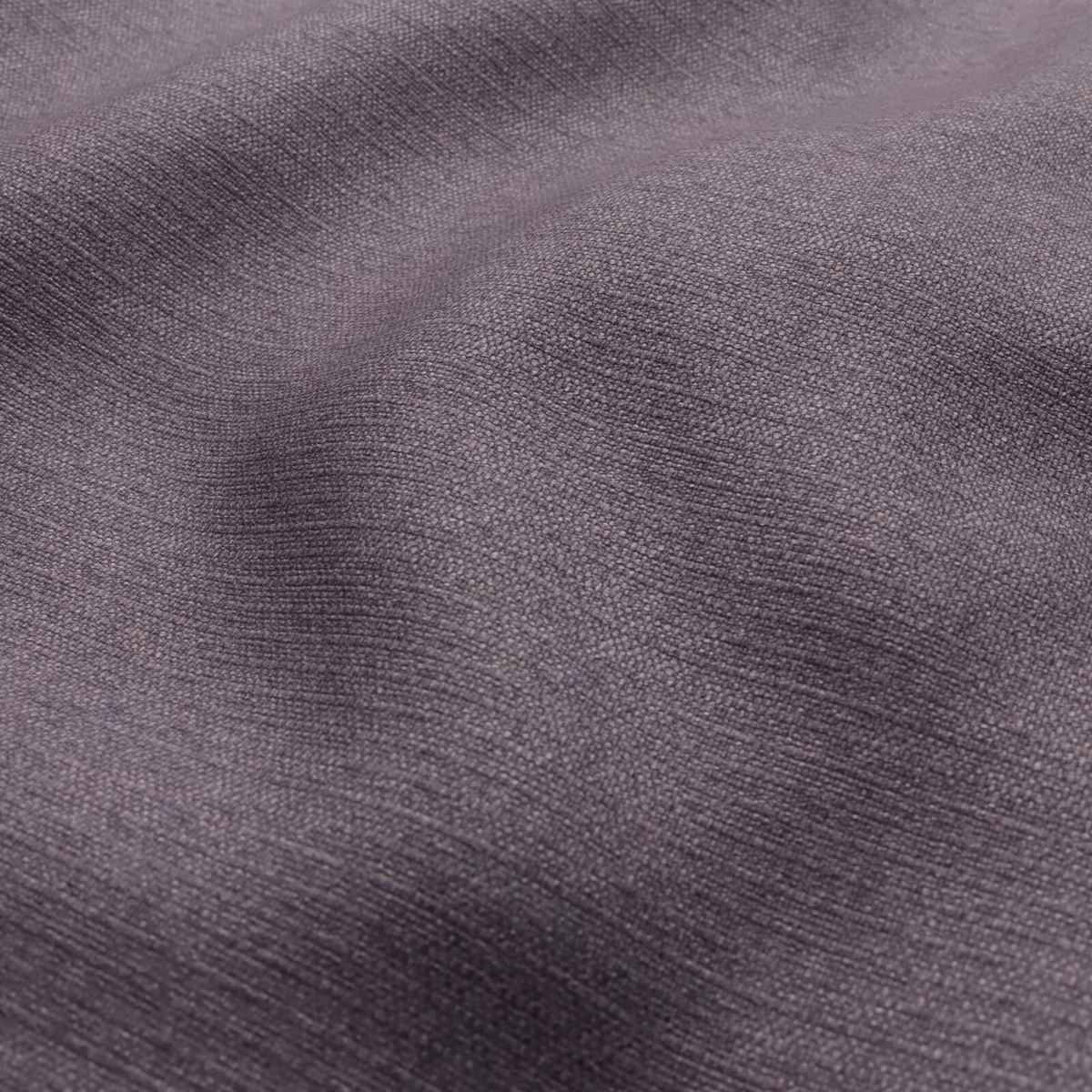 Close-up of cool grey-lavender fabric with a fine, softly rippled woven texture