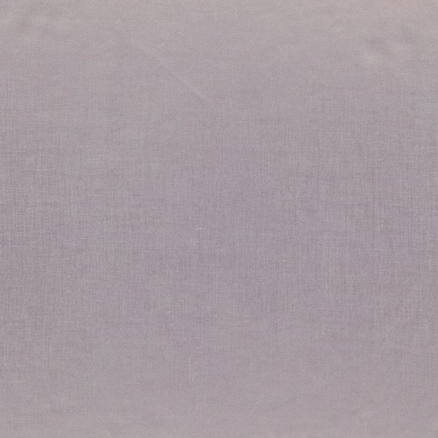 Close-up of soft grey lavender woven fabric with a fine, subtle texture