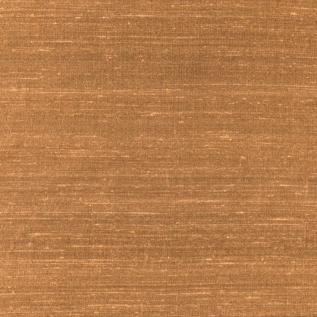 Warm cayenne copper fabric with fine horizontal slubs and softly varied woven texture