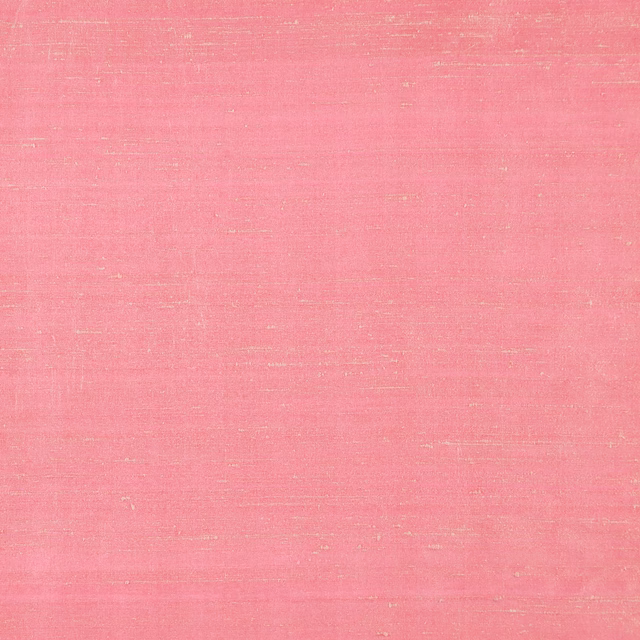 Coral pink textile with fine horizontal slubs and softly reflective surface