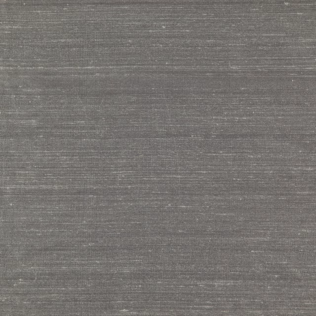 Close-up of cool slate-grey textile with fine horizontal striations and subtle sheen