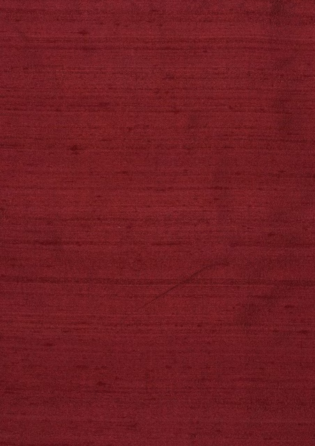 Deep cardinal red fabric with fine horizontal slub texture and subtle sheen
