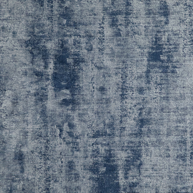Cool royal-blue woven swatch with cloudy blue-grey striations and a dry textured surface