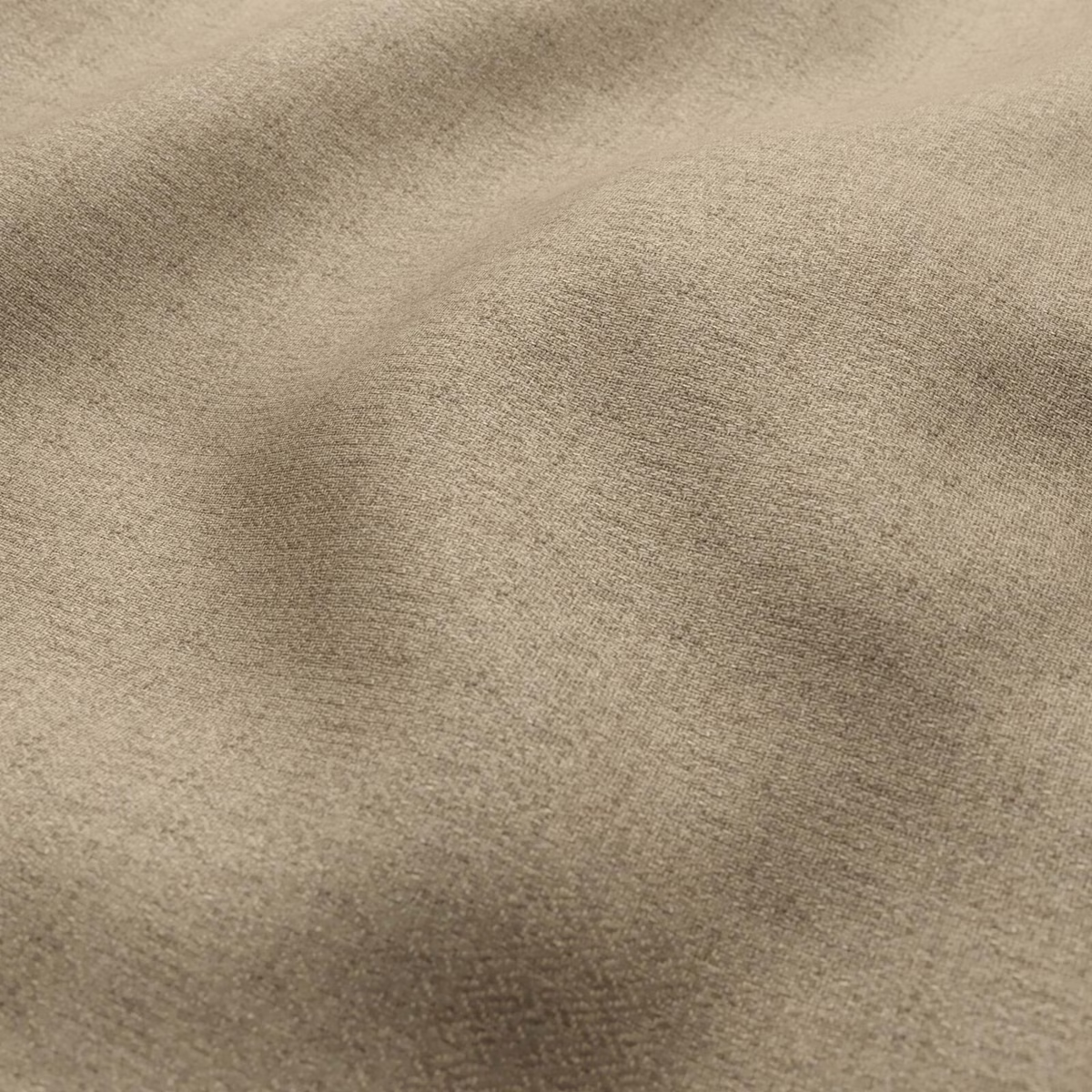 Close-up of warm taupe fabric showing a fine, softly tonal woven surface