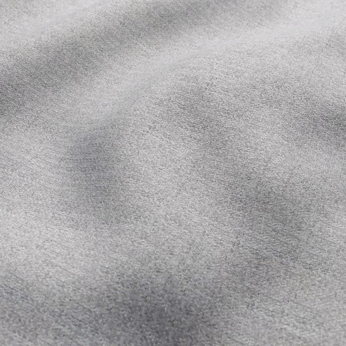 Close view of cool mist grey fabric with fine mottled woven texture