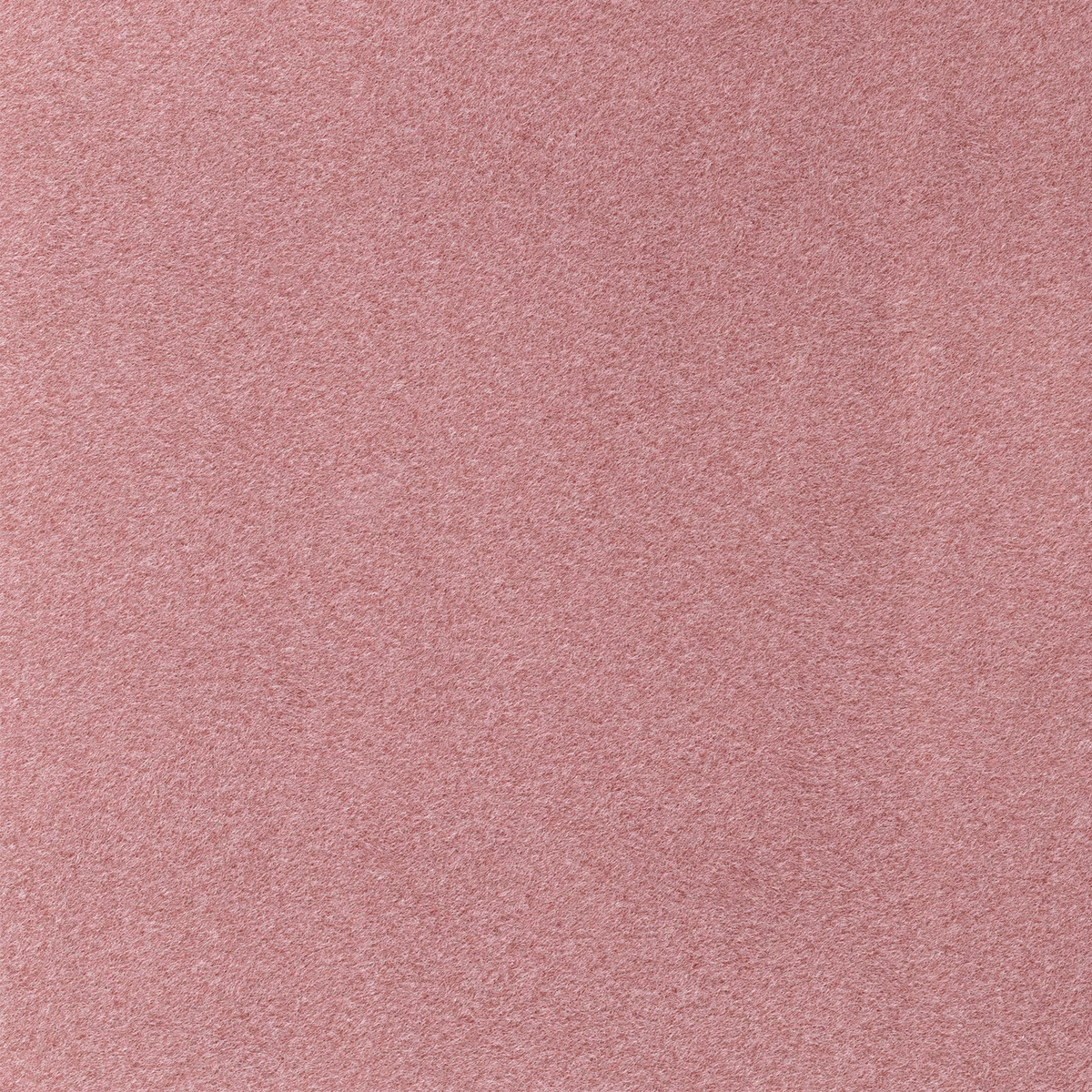 Dusty watermelon pink fabric with a fine softly brushed plain texture