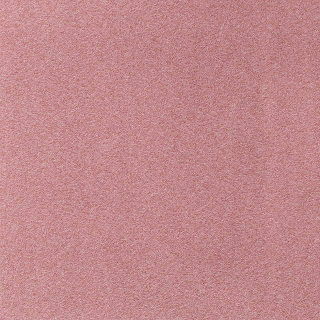 Dusty watermelon pink fabric with a fine softly brushed plain texture