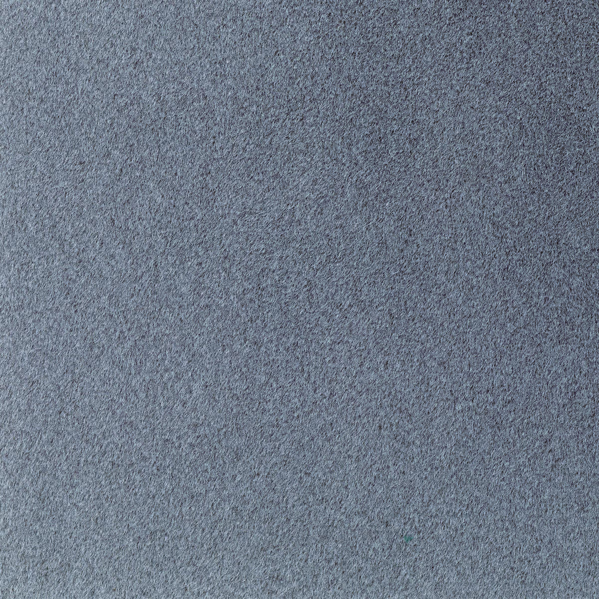 Close-up of cool blue-grey fabric with a dense, finely mottled texture