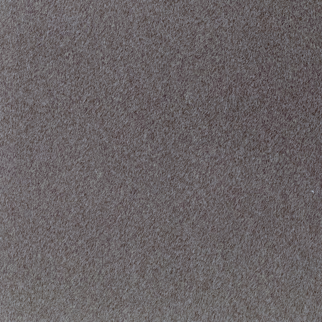 Close-up of mottled taupe-grey fabric with a dense, soft short-pile texture